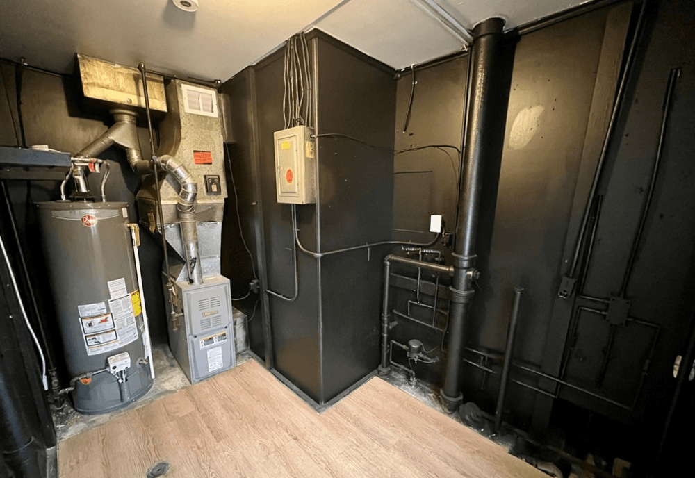 Updated Elyria mechanical room with new furnace and hot water tank